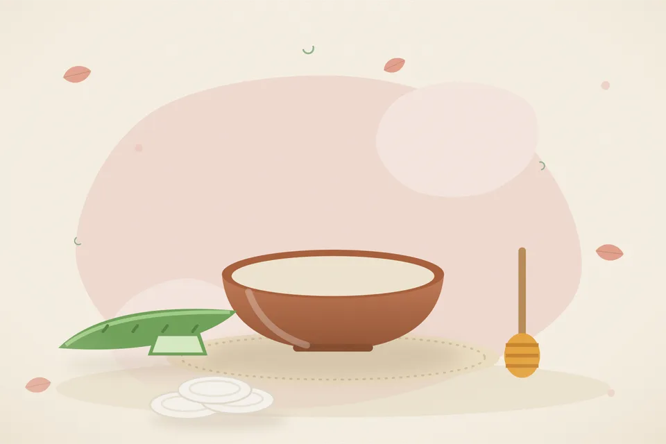Kitchen still life of a cut aloe vera leaf with clear gel and a spoon of honey on a plate, with no people and no text.