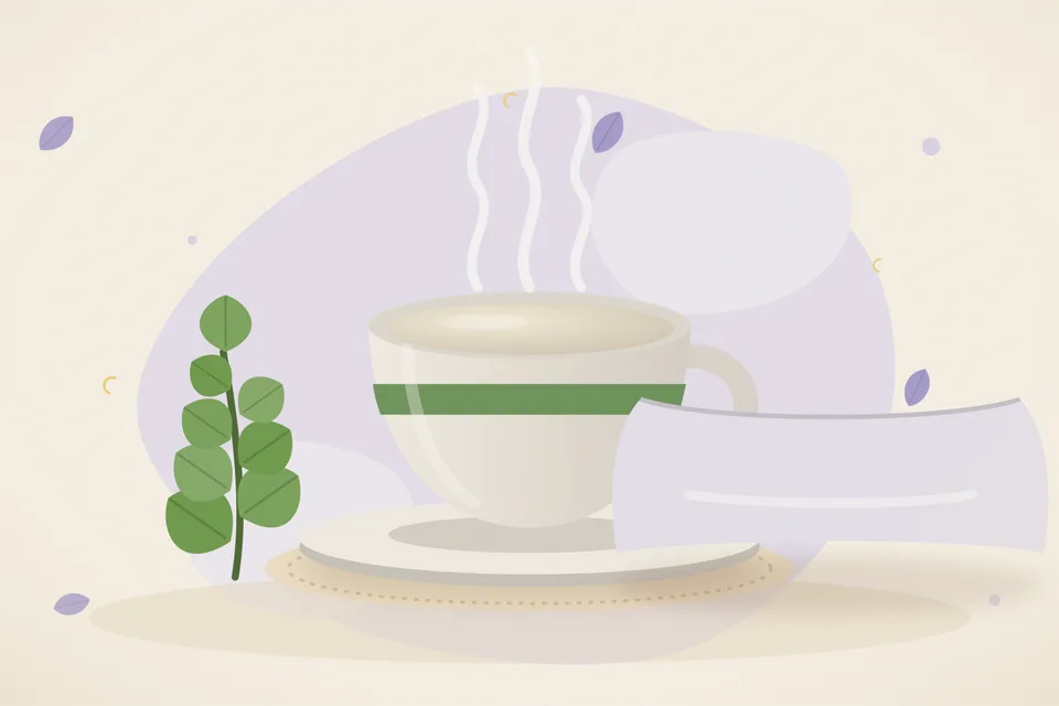 A cup of warm milk beside a tiny pinch of pale brahmi powder on a small plate, on an evening kitchen table.
