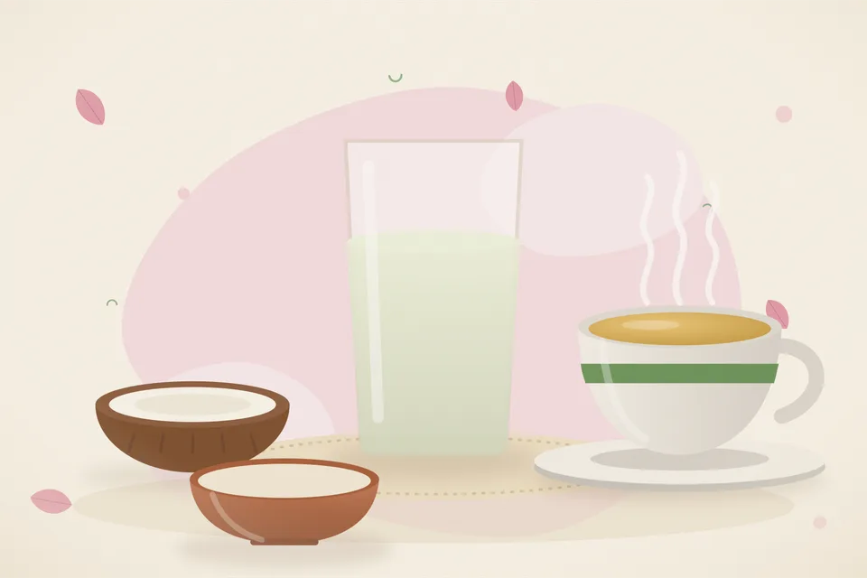 A clear glass of coconut water next to a split tender coconut on a wooden kitchen board in soft daylight.