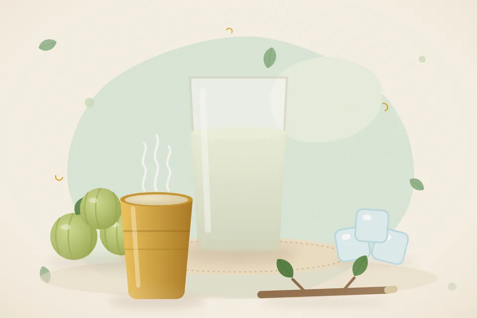 A small bowl of very pale diluted amla water next to one cut amla and a glass of plain water on a wooden board.