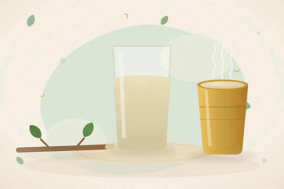 A soft green guava twig with a few leaves on a wooden board, next to a glass of rinse water and a small empty bowl.