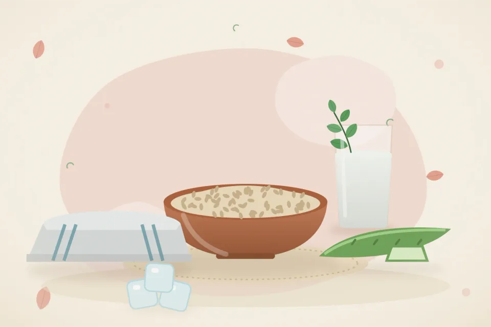 Ice cubes on a folded cloth, a bowl of oats, an aloe vera leaf and a glass of water with mint on a rose-pink background