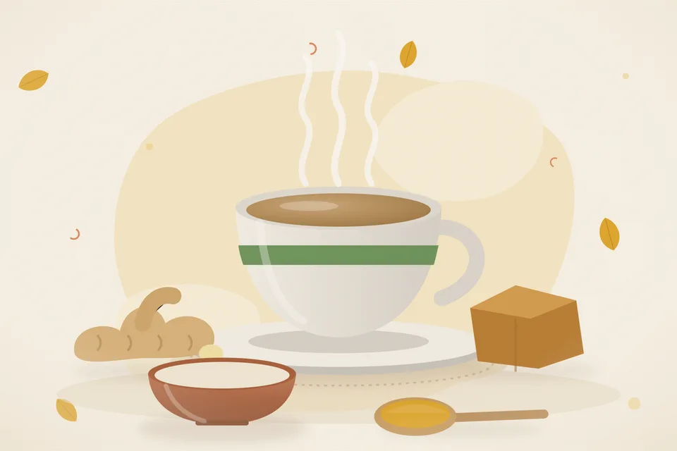 A small cup of pale ginger tea, a few ginger slices and a small piece of jaggery on a saucer in morning kitchen light.