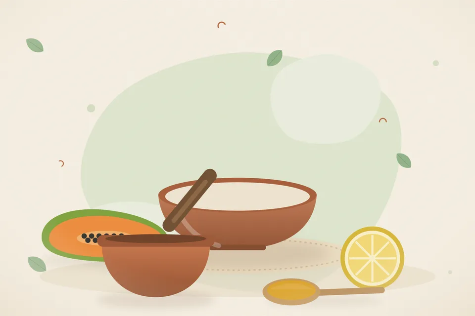 Cubes of ripe orange papaya on a plate with a lemon wedge and a pinch of rock salt, kitchen still life.