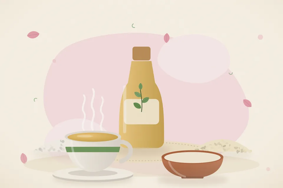 A wide steel basin of warm water with a small bowl of rock salt and a spoon of sesame oil on a kitchen floor mat.