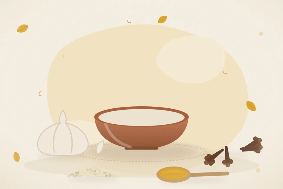 One soft golden garlic clove in a small tadka pan of ghee, next to a bowl of yellow dal on a kitchen stove.