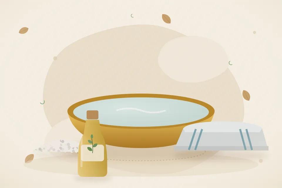 Coarse rock salt in a brass bowl and a thick folded cotton cloth on a wooden board