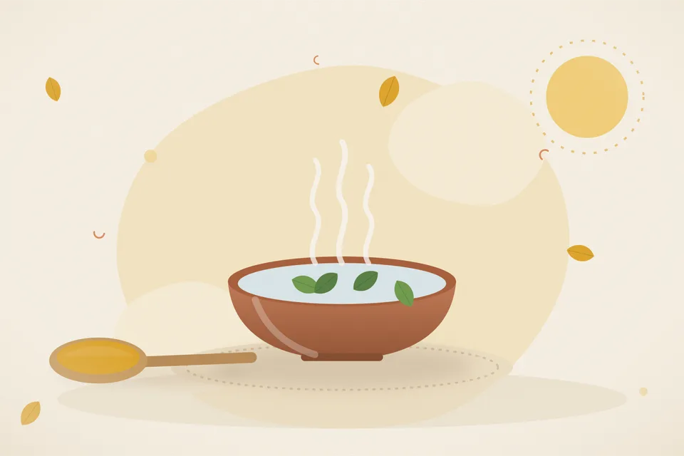 A small handful of soaked peanuts in a steel bowl of clear water, with a strainer and a spoon on a kitchen counter.